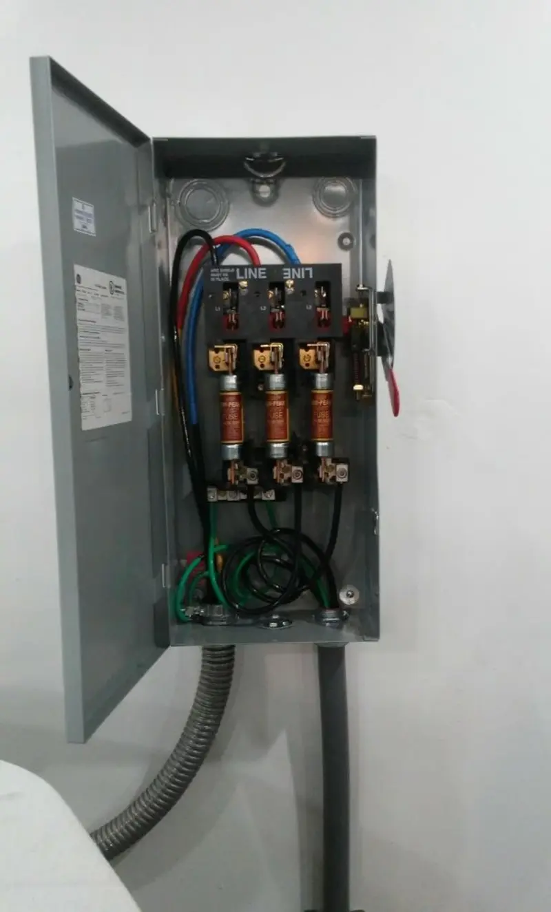 Three-phase disconnect switch installed for Smoke Detector Installation in Coe